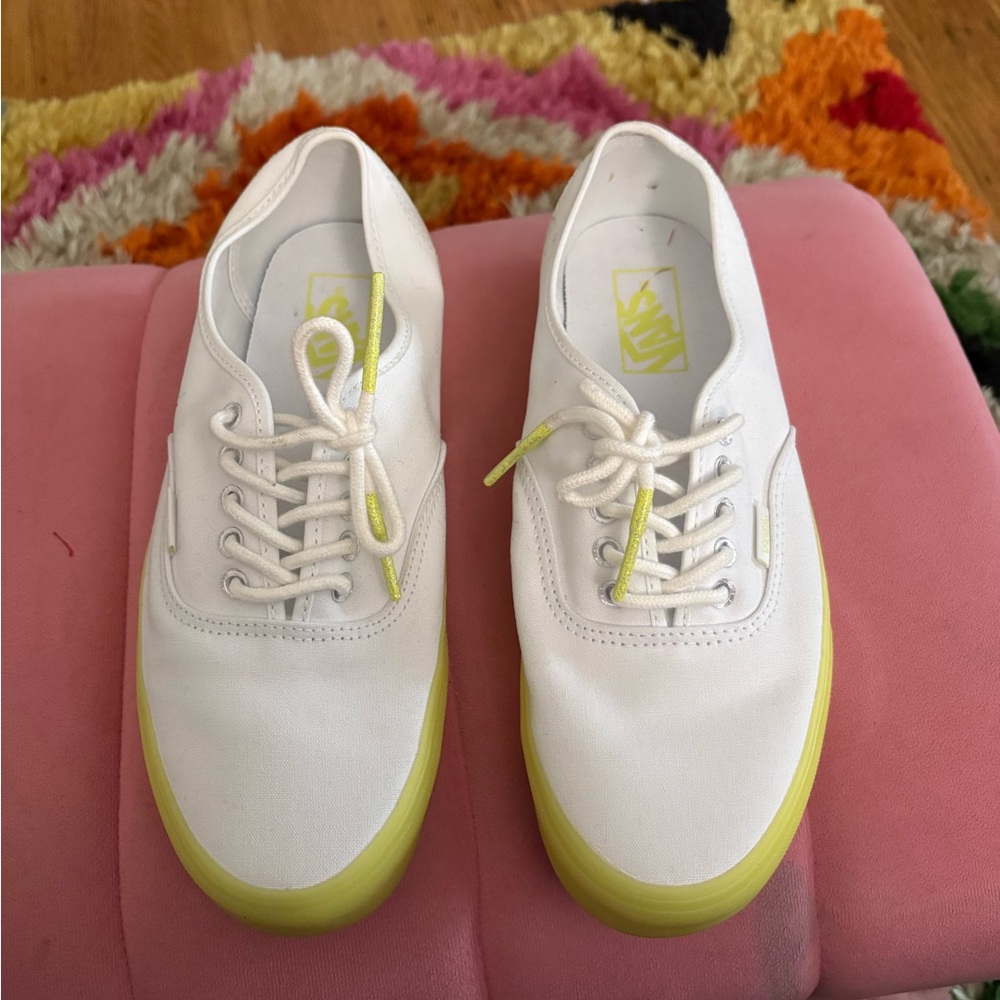 White vans with neon soles.